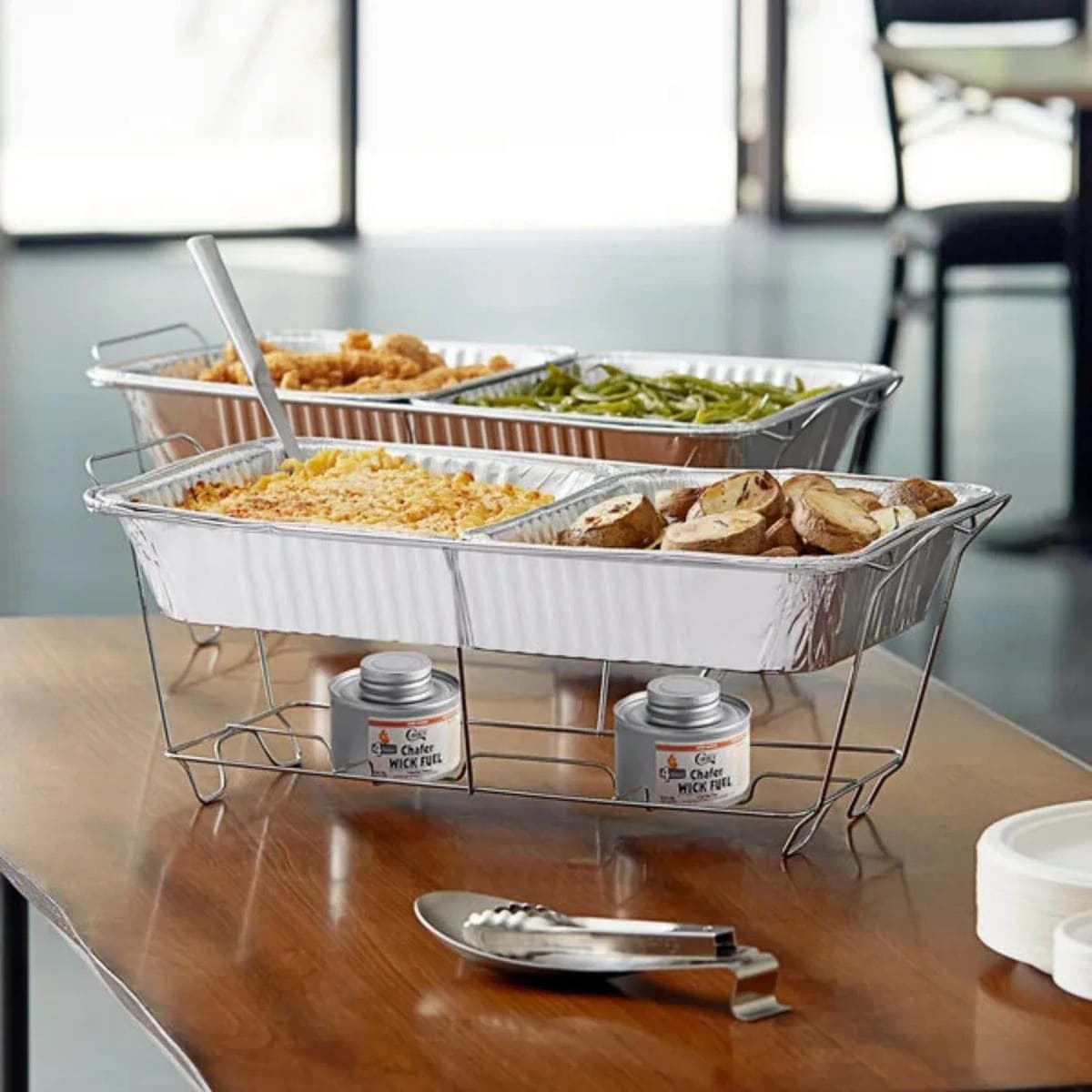 Catering trays in a chafing rack with sternos, ready to serve