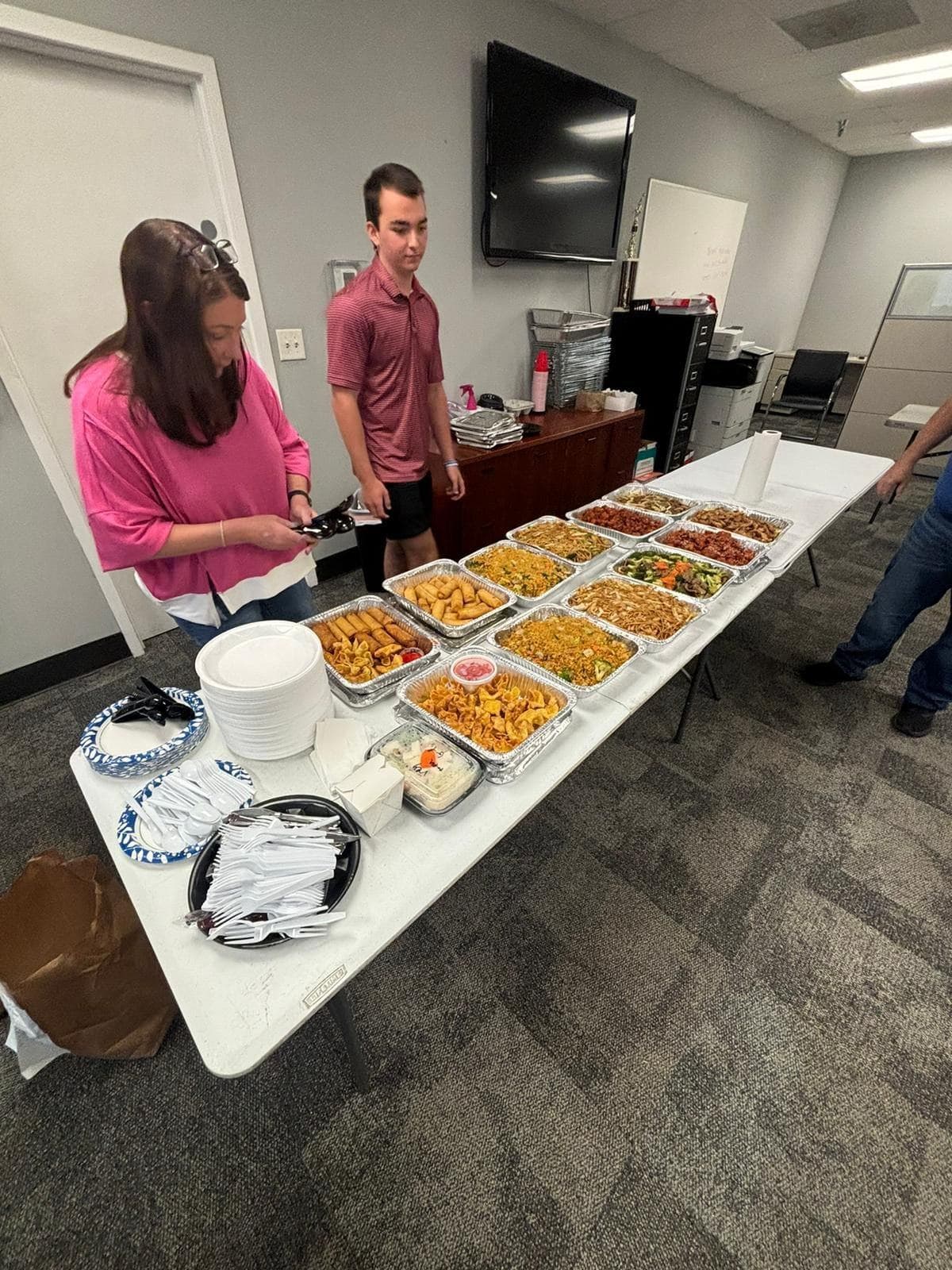 Team lunch buffet of Chinese food trays in an Atlanta office