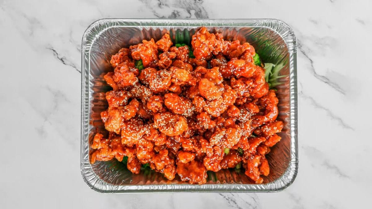Full catering tray of orange chicken